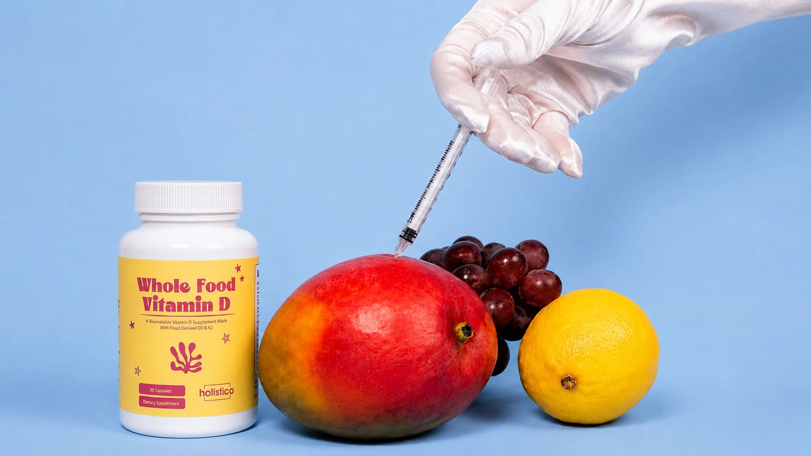A gloved hand injecting a syringe into a mango against a blue background